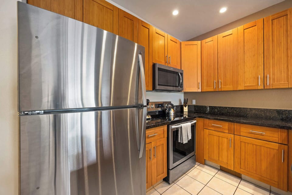 Full kitchen with full size refrigerator, stove, oven and microwave