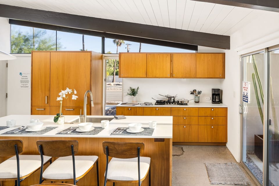 Nestled in the kitchen is a bar seating for four. 