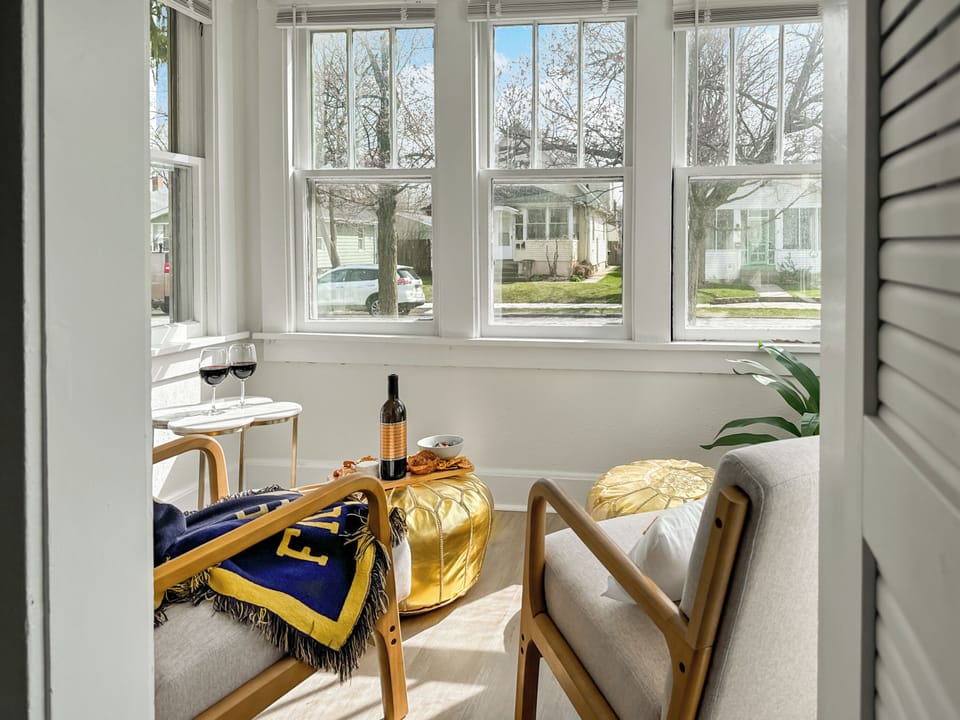 Our sunroom is quaint and cozy, making it the perfect spot for your morning coffee or tea, a relaxing read, journaling, or enjoying an afternoon glass of wine.