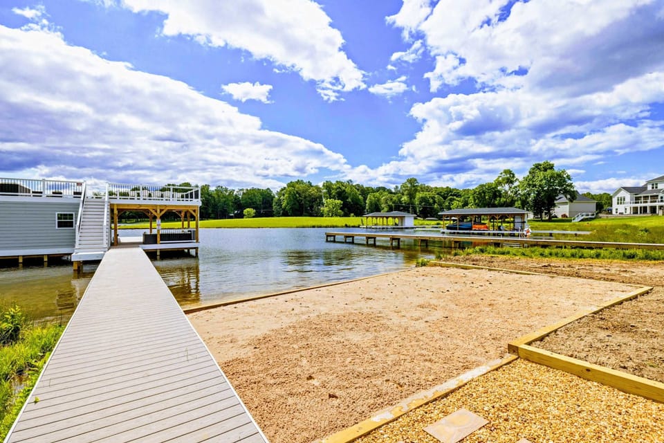 Backyard - A small sandy stretch along your shoreline, bare toes in the water a few steps from the dock.