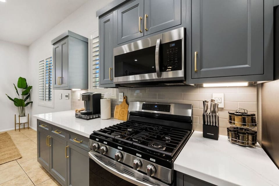 Modern kitchen w/ stainless appliances & sleek counters for everyday cooking.
