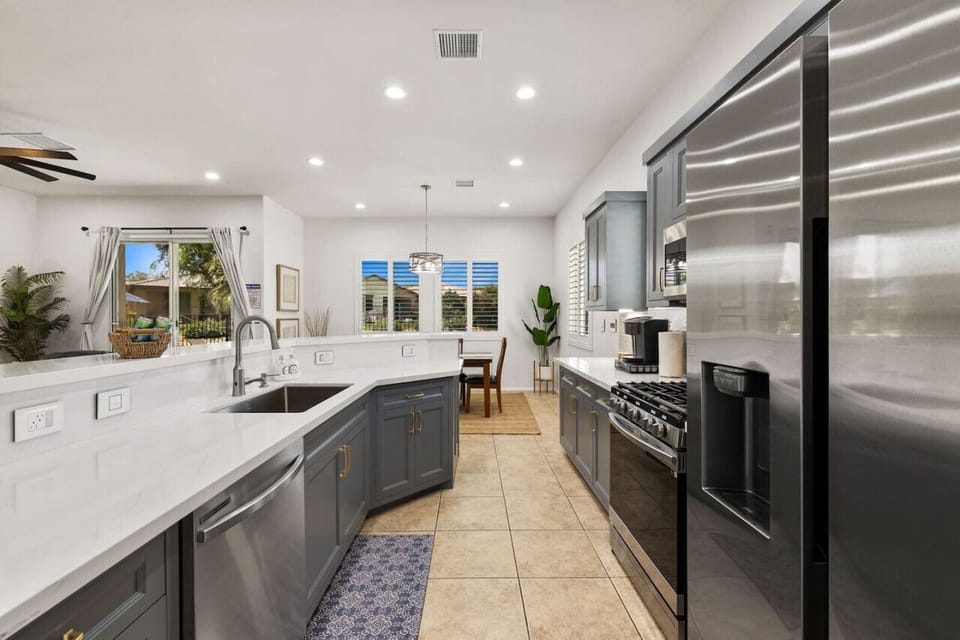 Sleek kitchen w/ ample prep space & modern appliances for cooking at home.