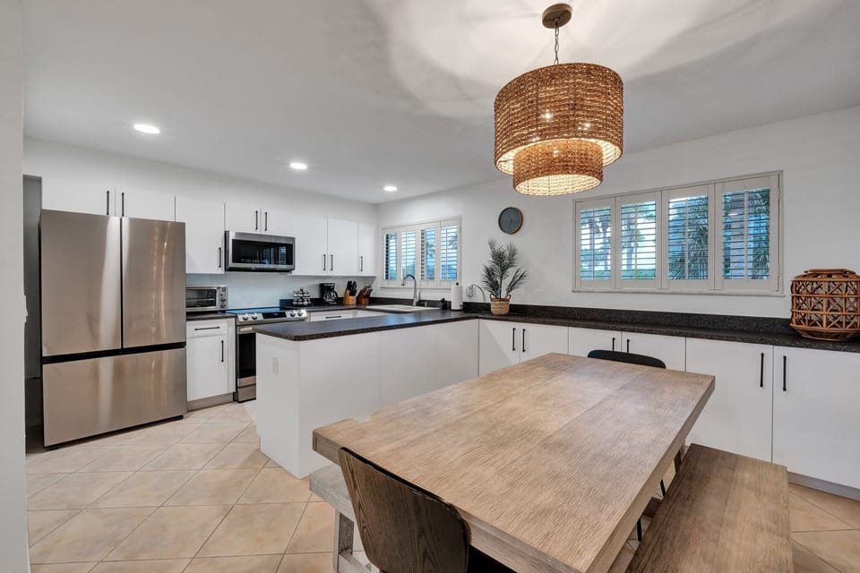 Enjoy meals together in the open-concept dining room with seating for six, seamlessly connected to the kitchen.