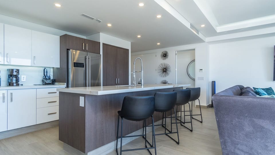 raised stools at the kitchen counter