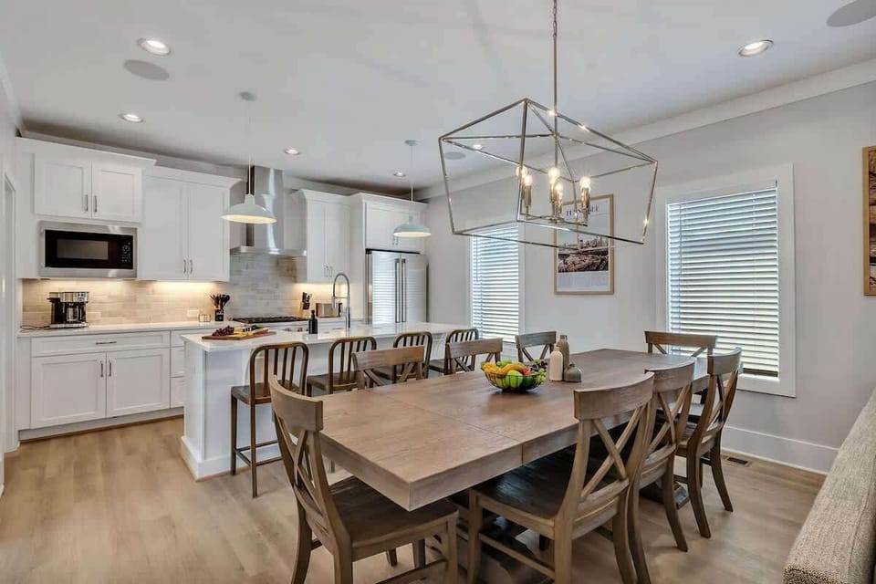 2nd Floor: Formal dining area featuring a large table set to accommodate 8 guests.