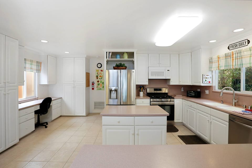 The kitchen has lots of space for the gourmet cook....and yes, that's a desk if you need to get some work done!