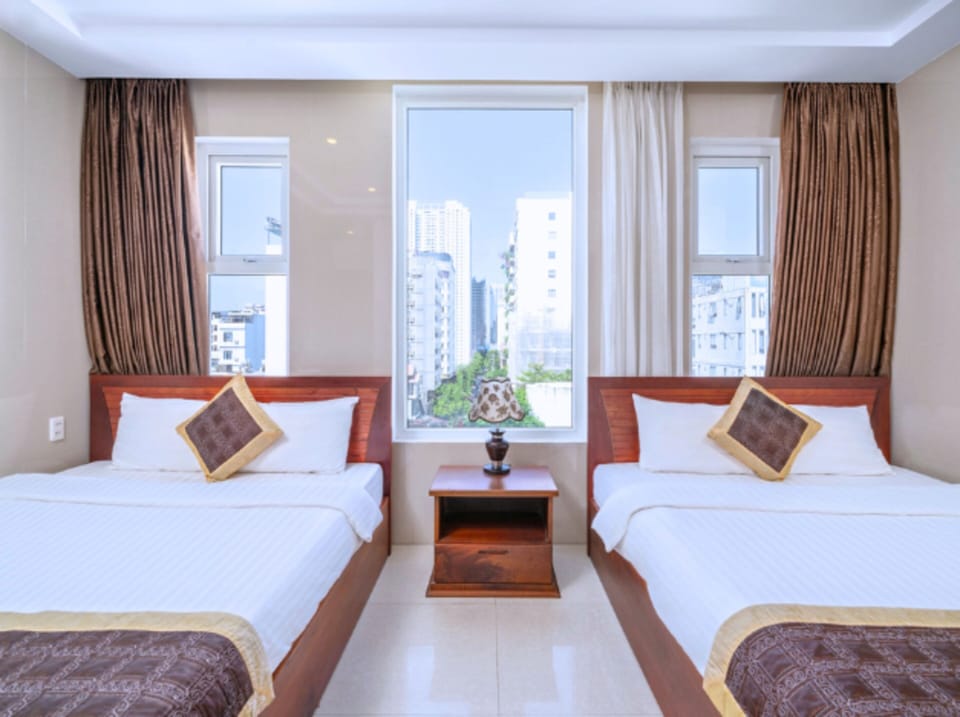 Panoramic Quadruple Room, 2 Queen Beds | Living area | 45-inch flat-screen TV with satellite channels, printers