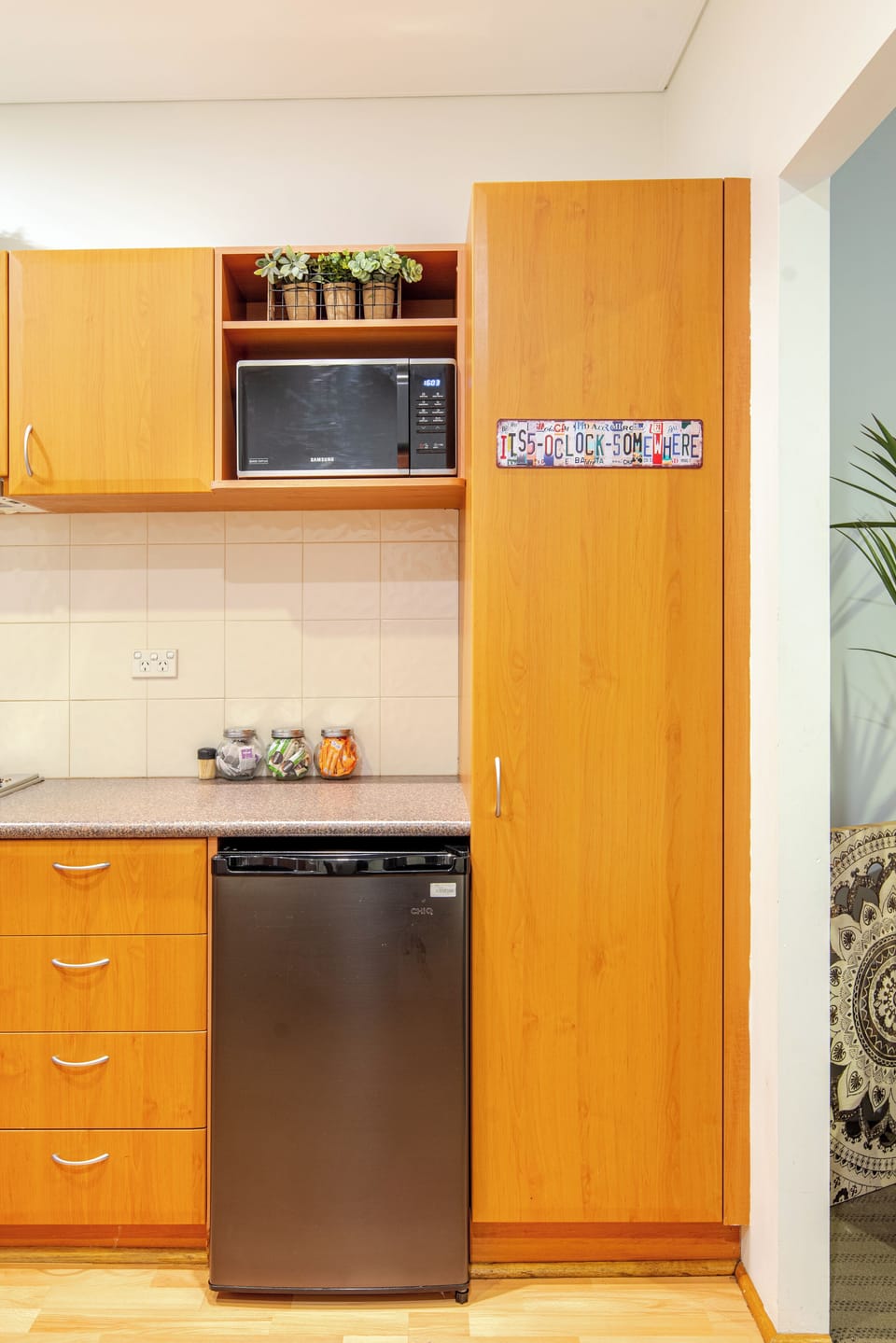A well-equipped kitchenette with a microwave, mini-fridge, and ample counter space for preparing light meals and snacks.