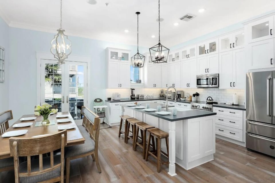 Well appointed, fully equipped kitchen, with big dining table and bar seating.