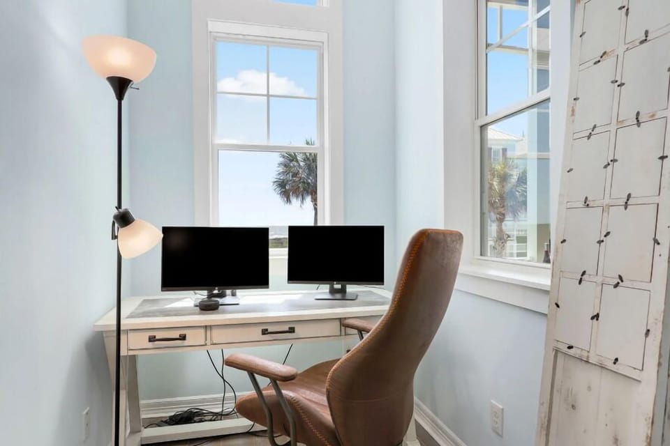Enjoy the ocean view while you work or play games.  just off living area.  Monitors and power strip provided for use.