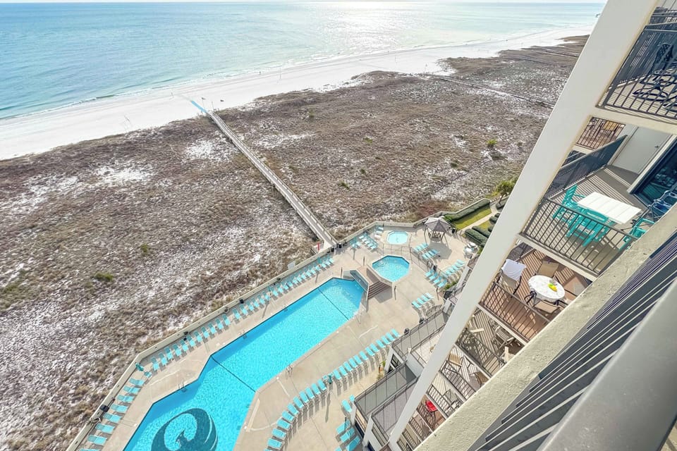 Balcony view of the beach and pool