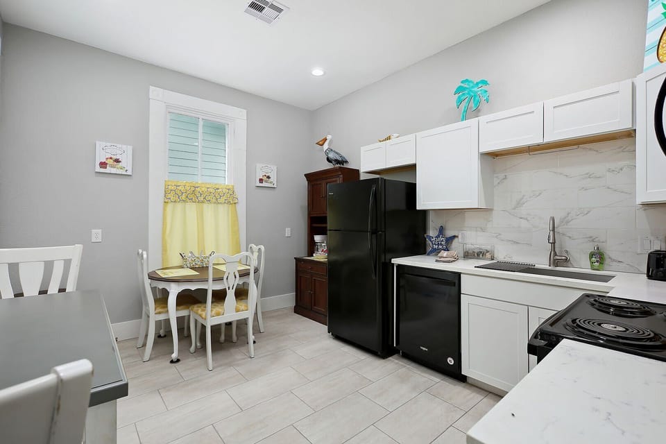 Large open kitchen with dining table seating up to 4. 
Additional breakfast table seating for 2.