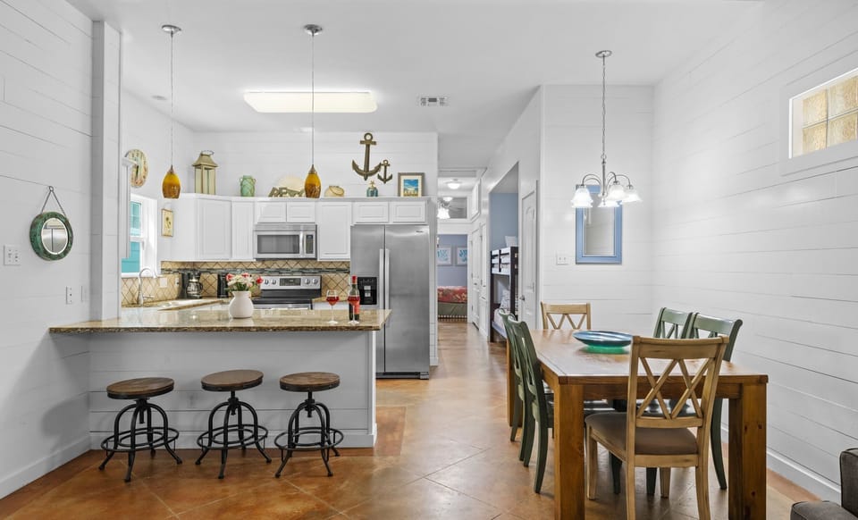 Kitchen & Dining — Bar Seating, White Cabinets & Nautical Anchor Decor