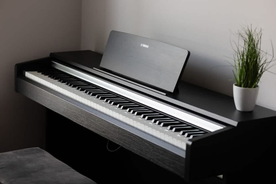 A digital keyboard set up in the bedroom corner. Great for guests who enjoy playing music.