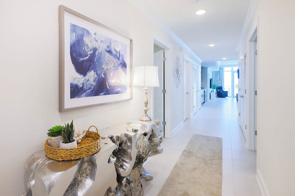 Step into the bright foyer, admire the sculpted console, and feel the welcoming vibe to this coastal retreat
