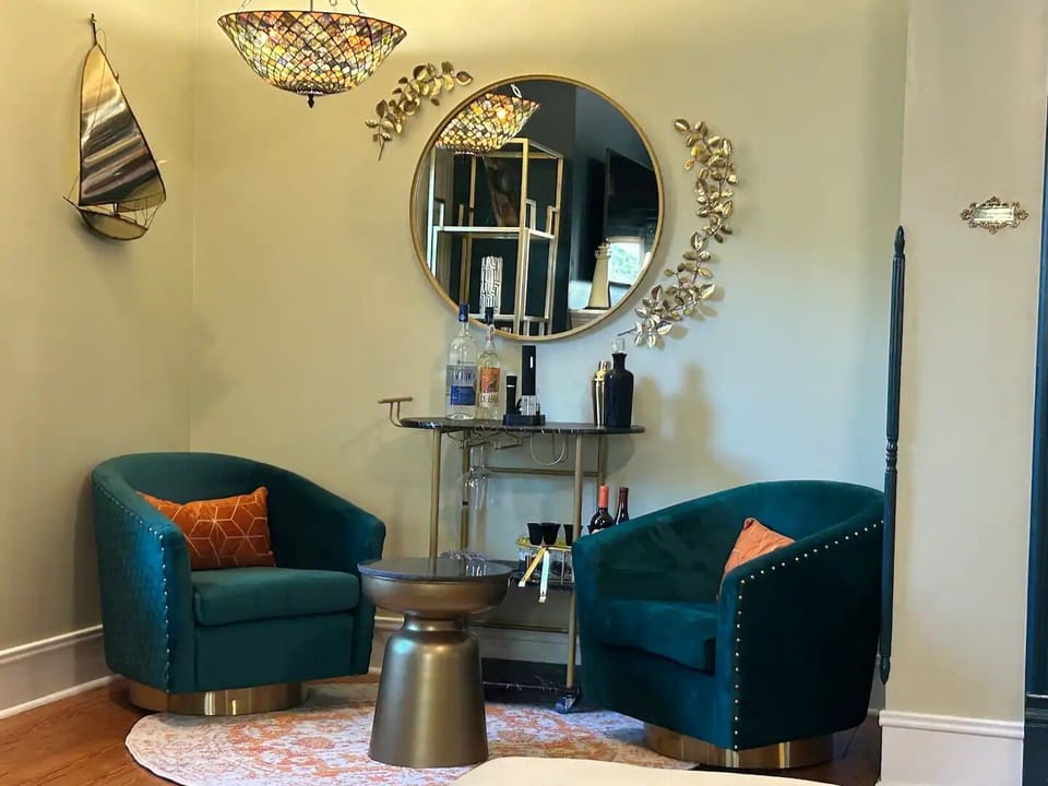 3rd swivel chair parlor area in living room with bar cart access, view of room!