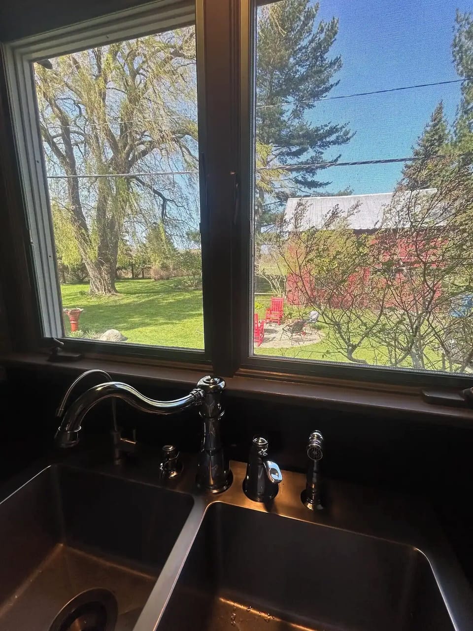 View from kitchen sink of yard. That sink provides triple reverse osmosis H20!!