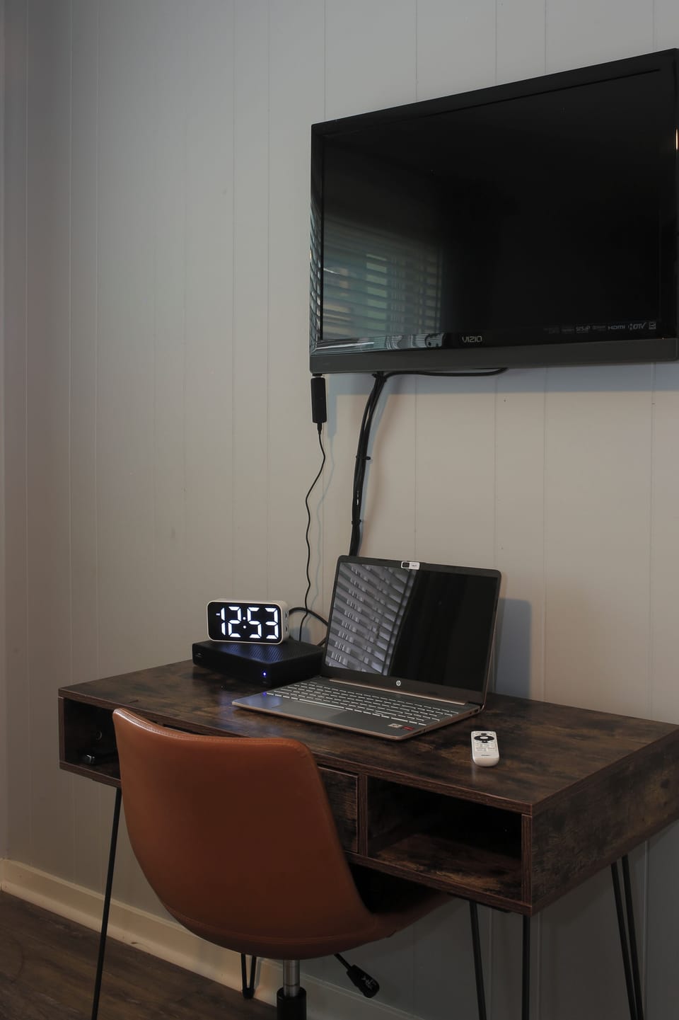Workspace and smart TV in queen bedroom 