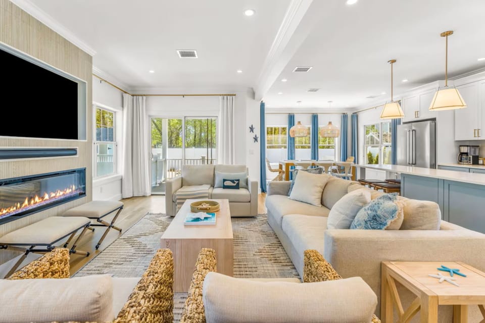 Living room, kitchen and porch and dining area in background