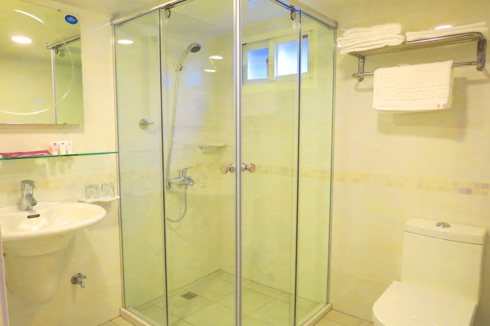 Standard Suite | Bathroom | Rainfall showerhead, free toiletries, hair dryer, bathrobes