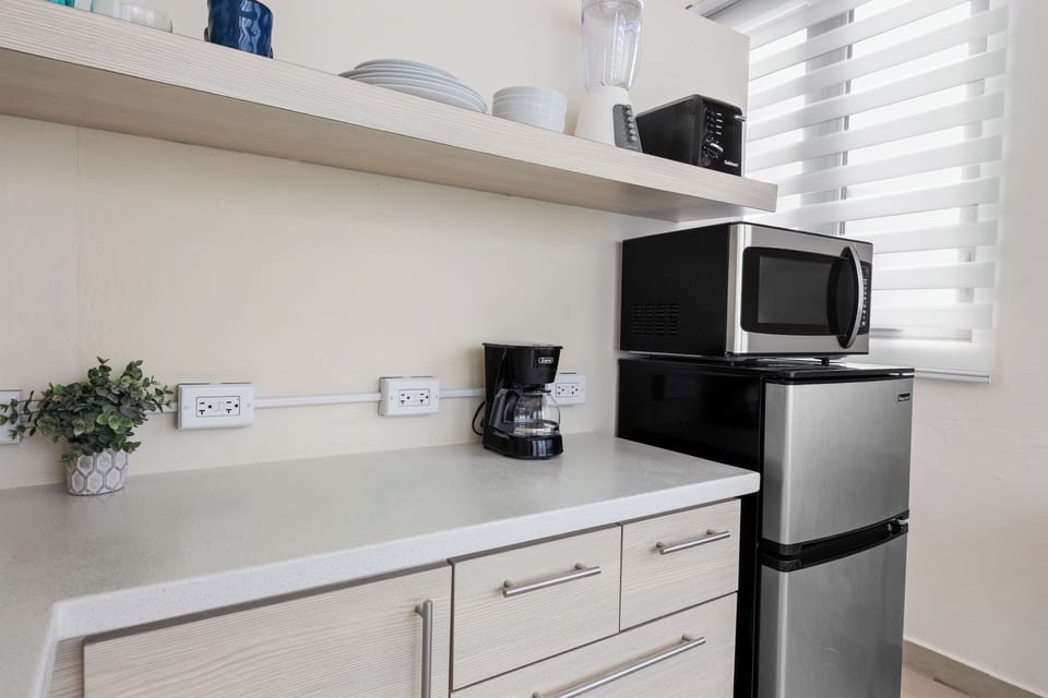 Fully stocked kitchenette.
