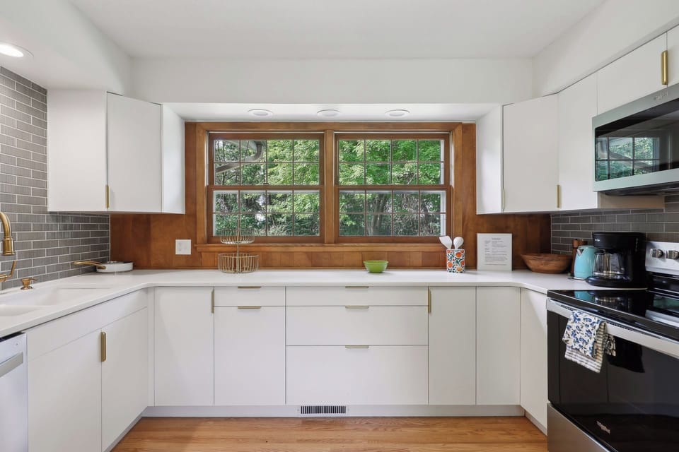 Kitchen overlooks the beautiful backyard.