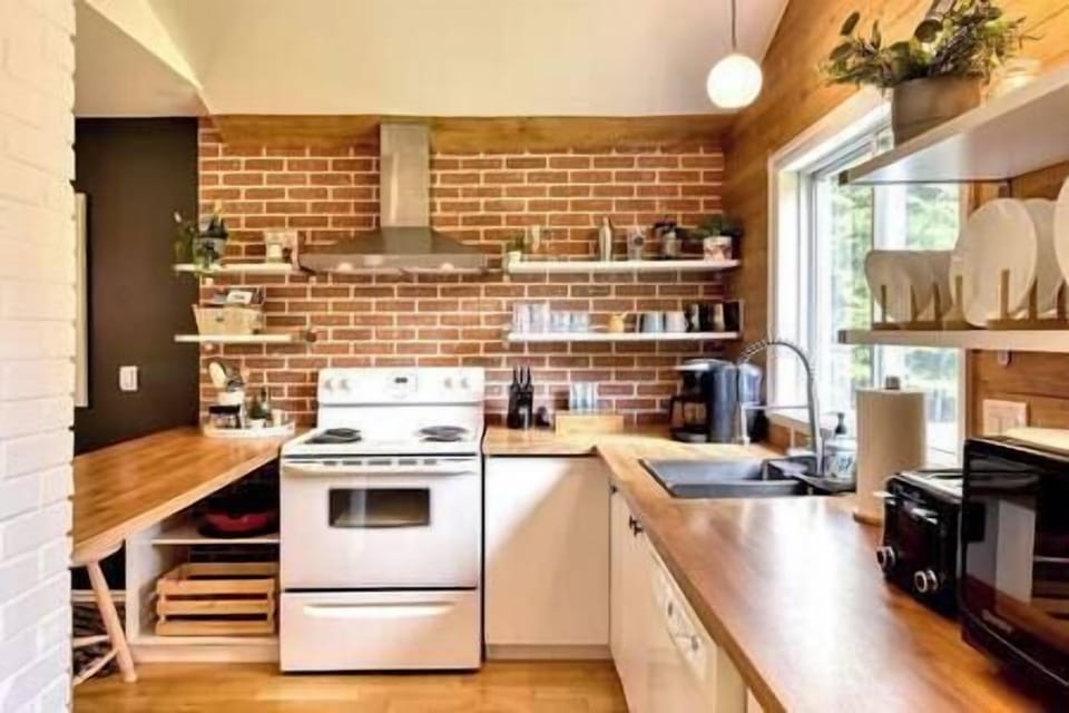 Cook up a feast in the fully equipped kitchen, featuring essential appliances.