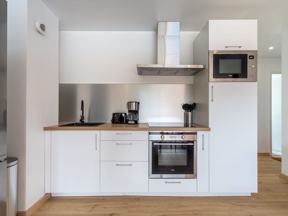 Cabinetry, Property, Countertop, Building, Wood, Sink, Kitchen Stove, Interior Design, Home Appliance, Flooring
