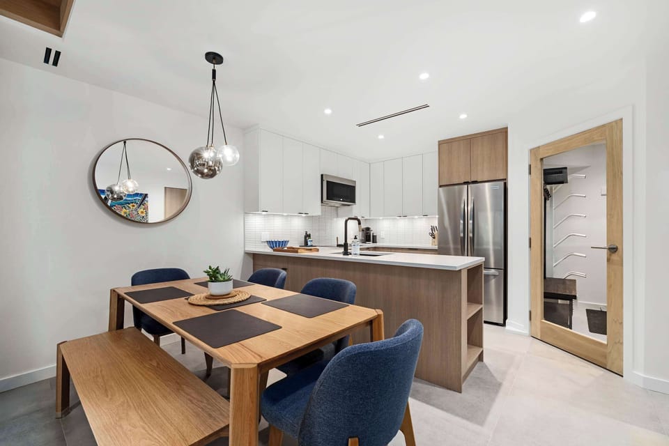 - Fully equipped kitchen with granite counters and sleek stainless appliances - Open layout connects to living and dining area filled with natural sunlight - Perfect for family stays and friends who enjoy relaxed home-style cooking