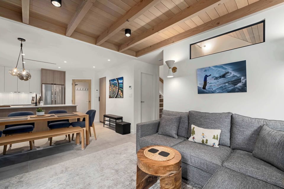 - Enjoy open-concept living with modern alpine décor - Cozy up by the stone fireplace or stream your favorite shows on the flat-screen TV - Perfect gathering space for après-ski relaxation and memorable evenings