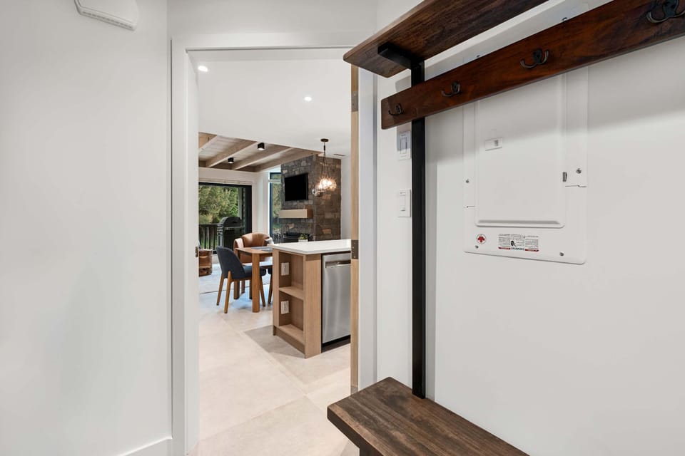 - Entryway with organized gear storage and built-in boot racks - Ideal for drying ski gear and keeping adventure essentials handy - Clean, modern setup welcoming you home after a day outdoors