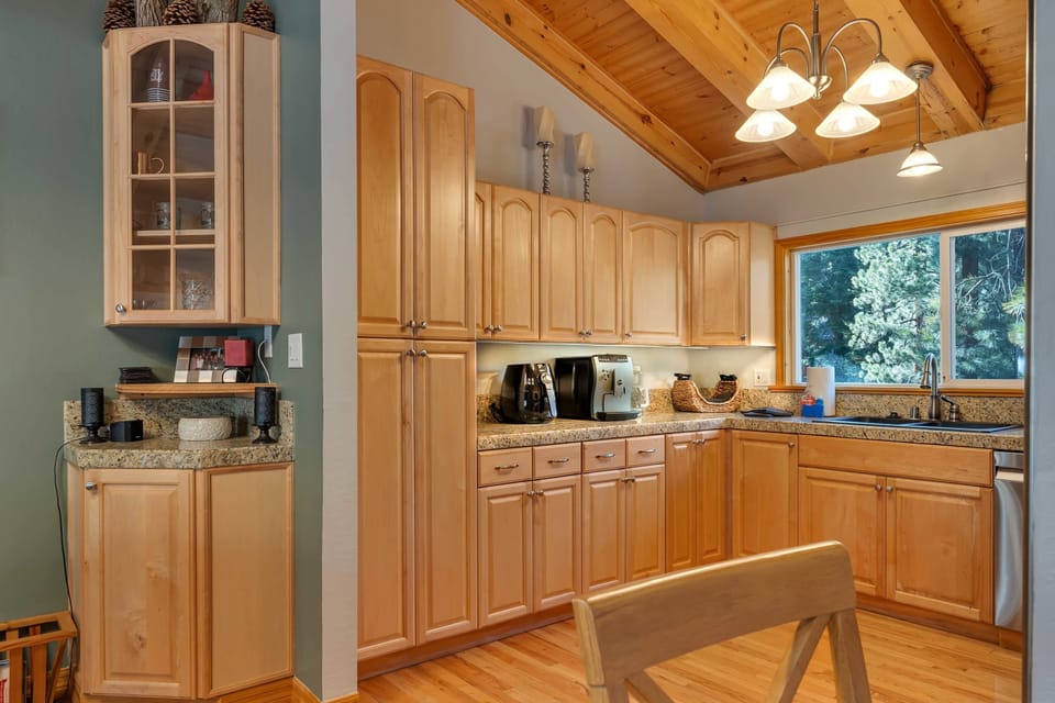 The kitchen features updated appliances, spacious countertops, and ample storage space.
