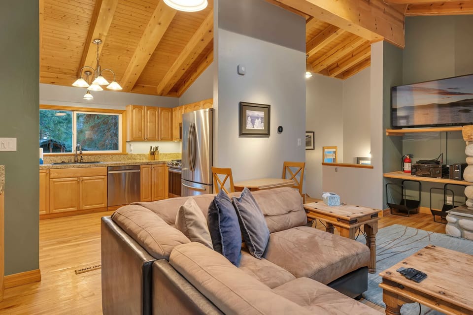 The kitchen is located just off the living room keeping you connected to your group while you prepare meals.