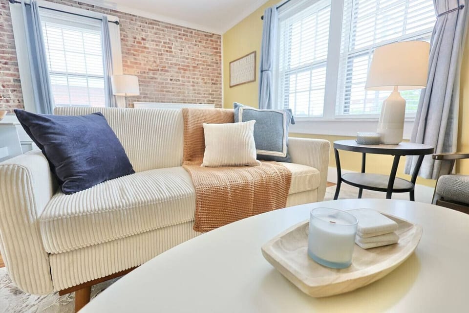 Living Room Retreat: Bright space with charming decor, inviting comfort, and natural light!