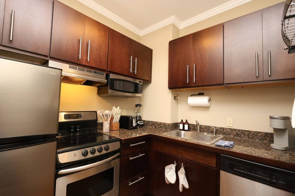 Kitchen: Cook up a storm in this modern space with sleek appliances and stylish finishes!