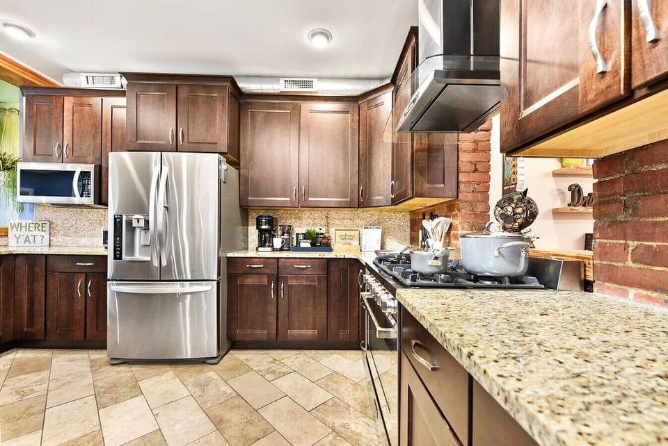 Kitchen with stainless steel appliances and granite countertops.