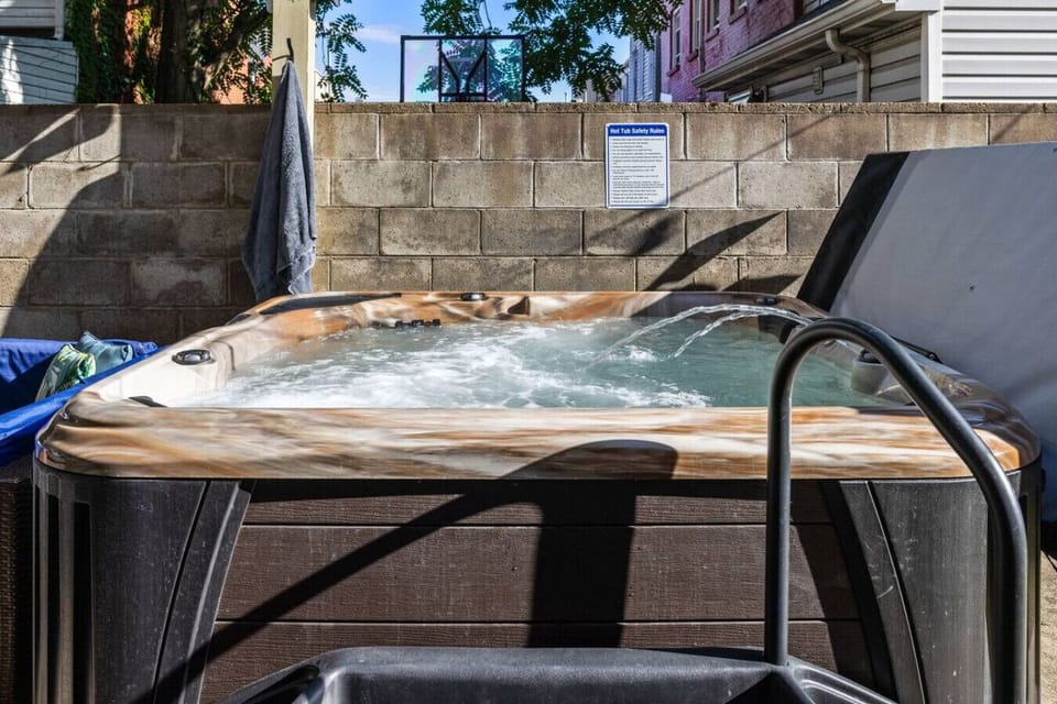 Soak in the hot tub and unwind in the private outdoor space—perfect for relaxing after a long day.