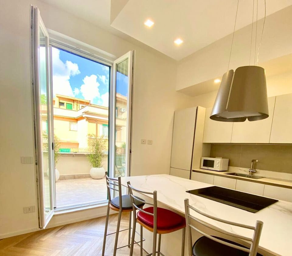 Fully equipped kitchen with oven, toaster, microwave, dishwasher and more.