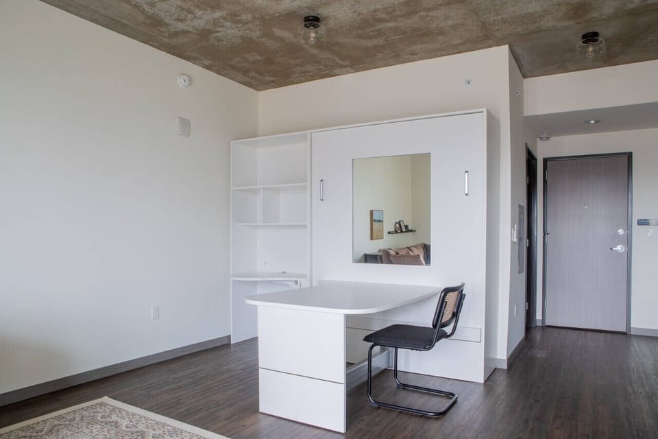 Smartly designed Murphy bed transforms the space in seconds—enjoy a comfortable night’s sleep without sacrificing daytime living space