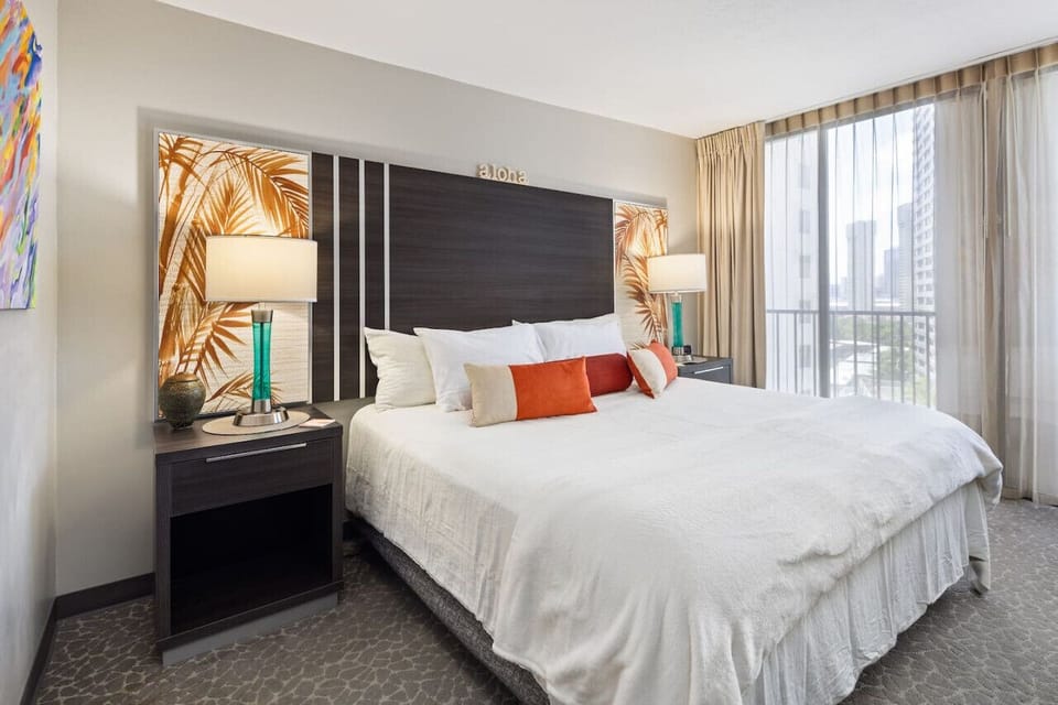 Bright bedroom w/ soft light & balcony vibes for slow, easy mornings.