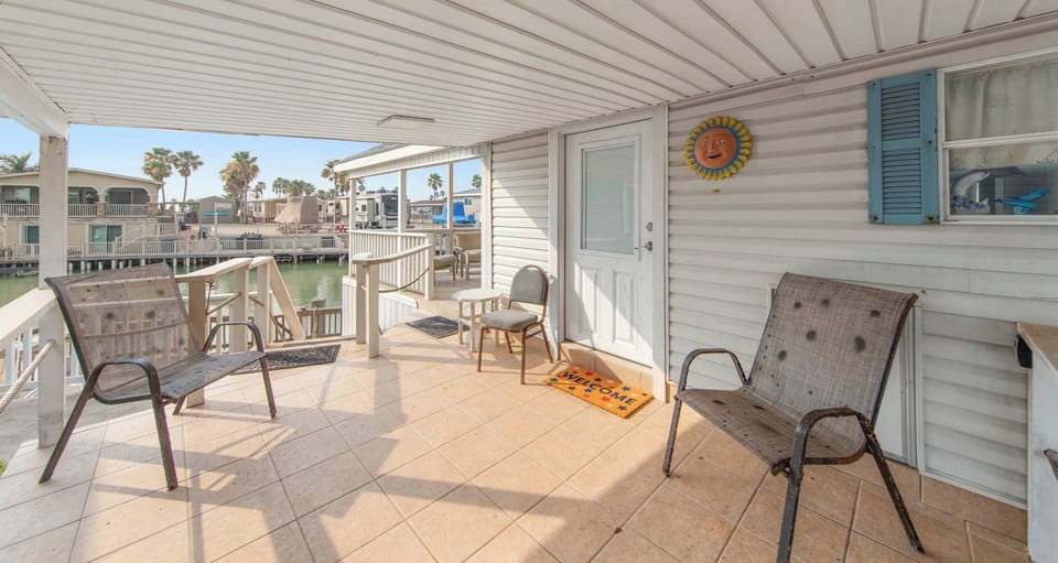 Unwind on the covered deck with canal and community views