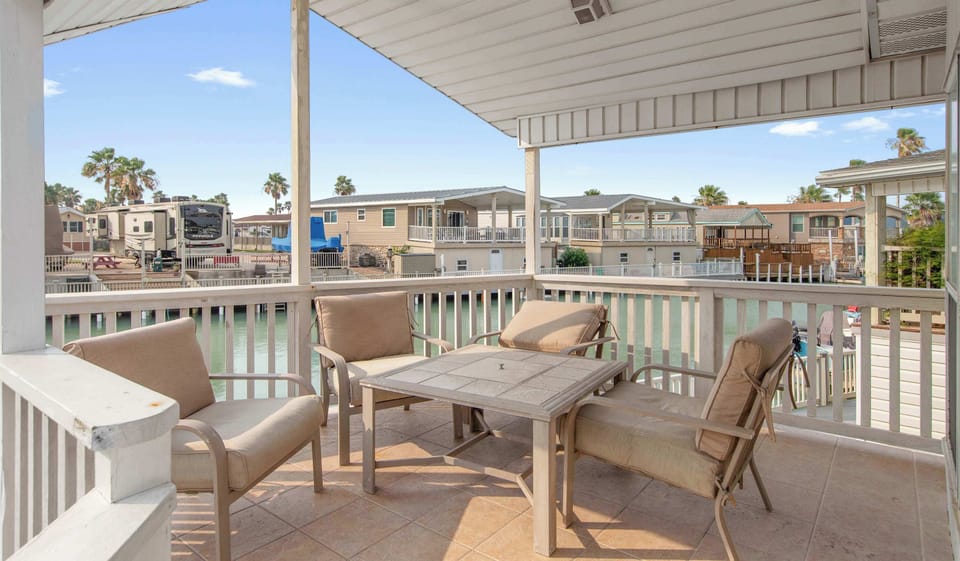 Dine alfresco on the covered deck overlooking the canal