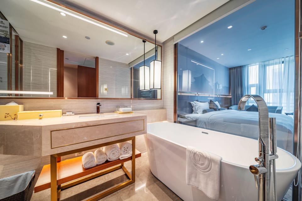 Lia Premier Room | Bathroom | Shower, rainfall showerhead, free toiletries, hair dryer