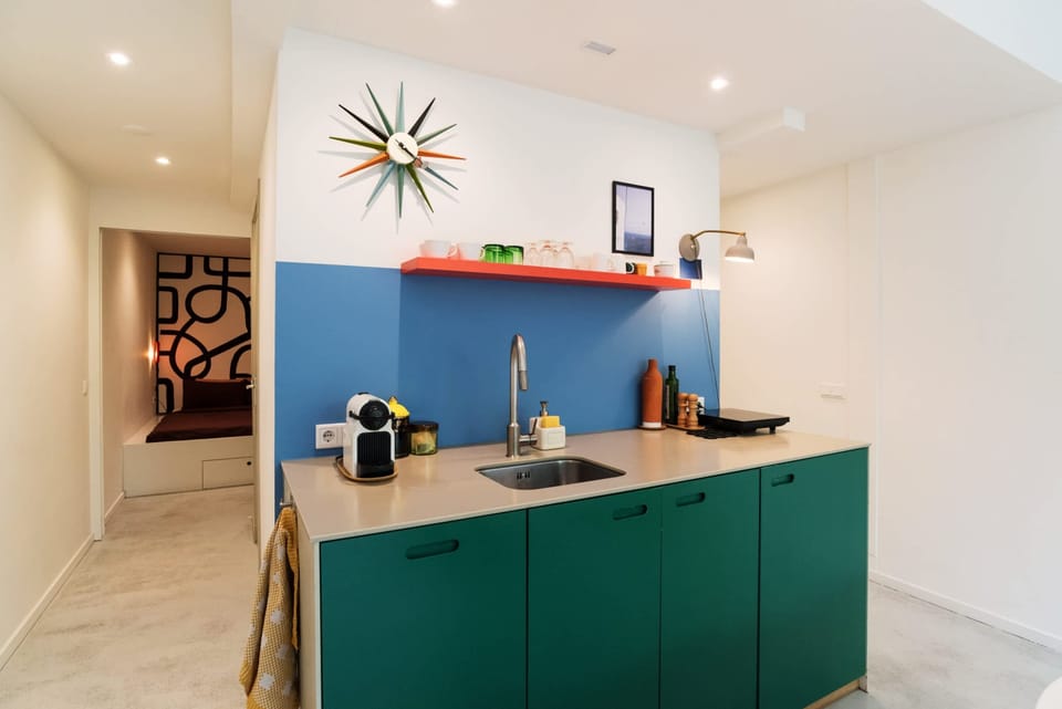 The kitchen is available to use - including a coffee machine, sink, and small induction cooking plate