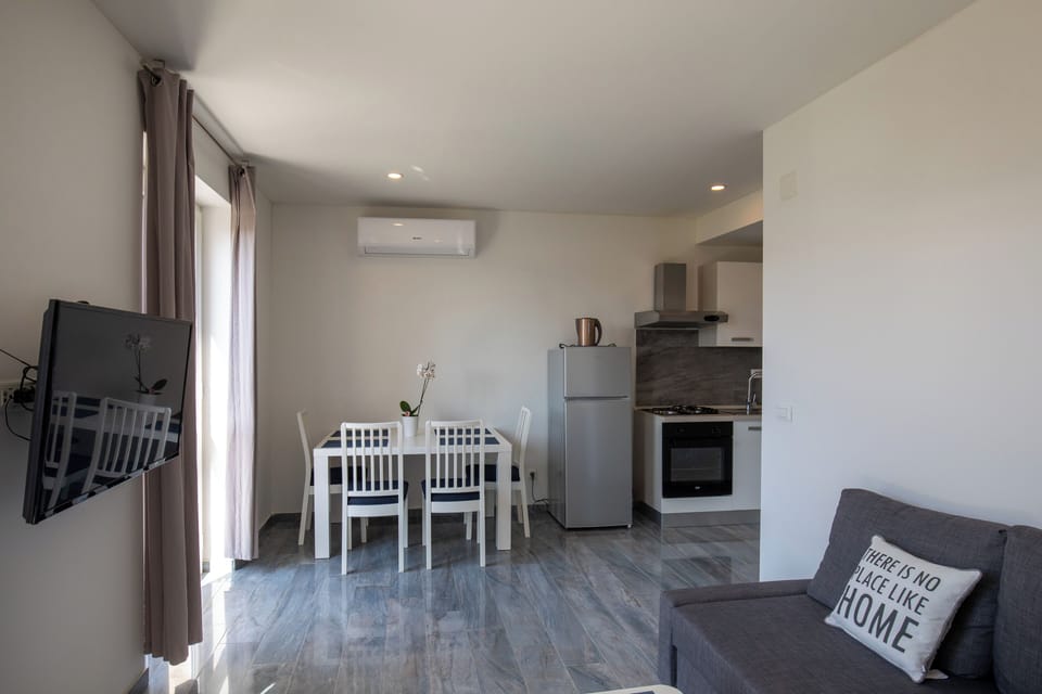 Apartment (Begović Guest House - One-Bedroom Ap) | Living room | 32-inch flat-screen TV with cable channels