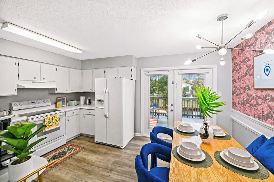 Cook, eat and relax in the airy kitchen & dining area—with direct terrace views