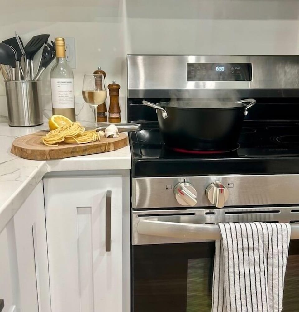  - Fresh ingredients and cookware ready for dining  
- Enjoy home-cooked meals with modern appliances  
