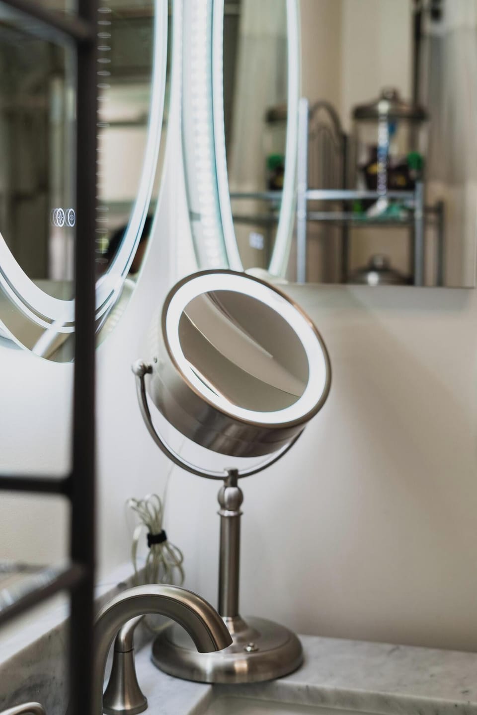 - Modern bathroom with lighted mirror and vanity setup  
- Makeup mirror provided for added guest convenience  
- Thoughtful touches designed to enhance your stay  
