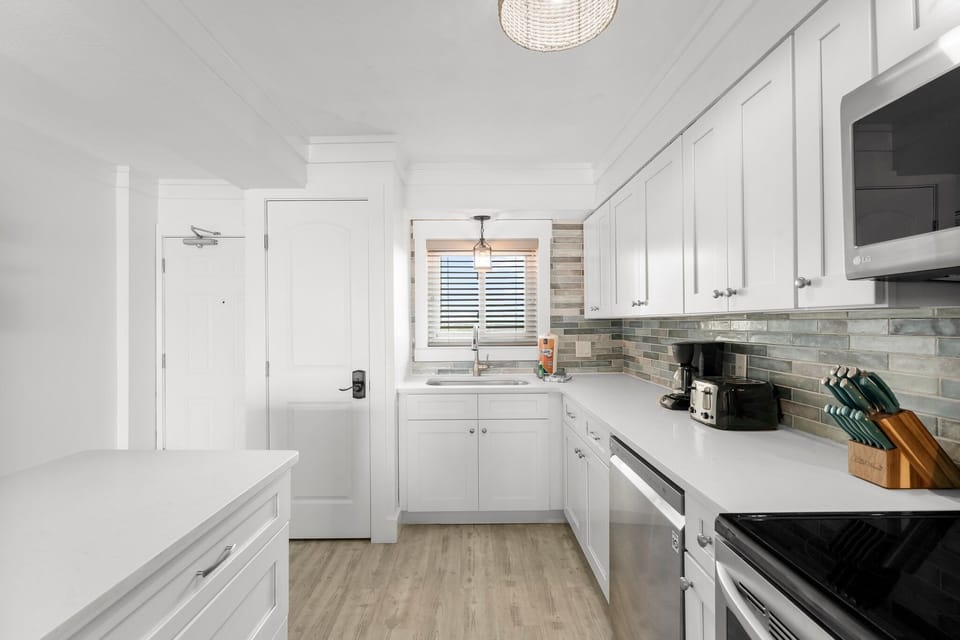 Gasp at the beautiful sunrise every morning while preparing your morning coffee in our coastal-inspired kitchen.