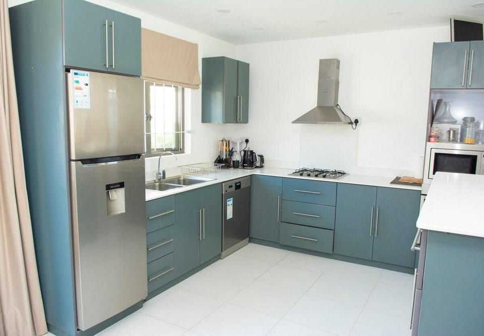 Villa | Private kitchen | Fridge, microwave, oven, stovetop